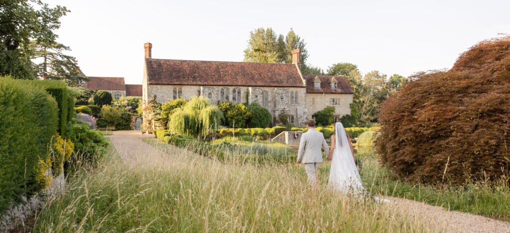 Newly married couple in the gardens at Nettlestead Place in Kent